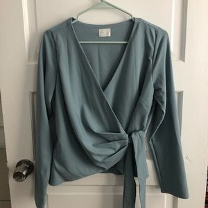 V-neck light blue/teal wrap top